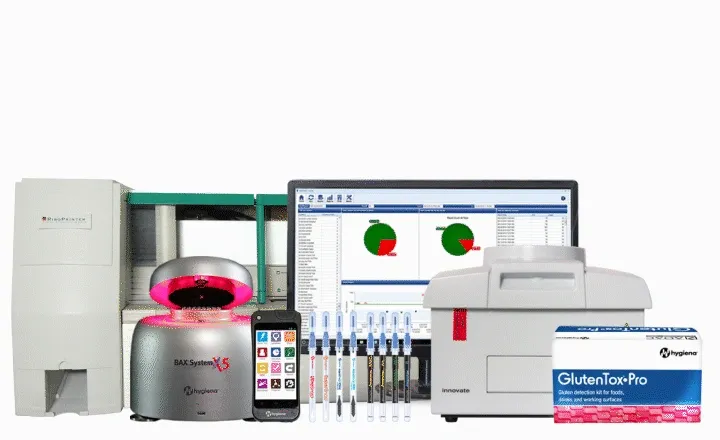 Allergen test kits and detection devices for foods and food processing areas displayed with a computer screen showing data.