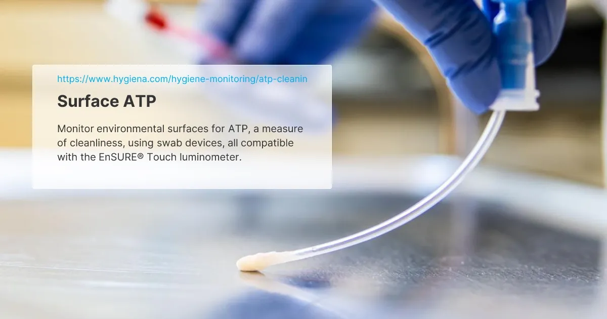 Gloved hand holding a swab device used for monitoring surface cleanliness with ATP testing technology.