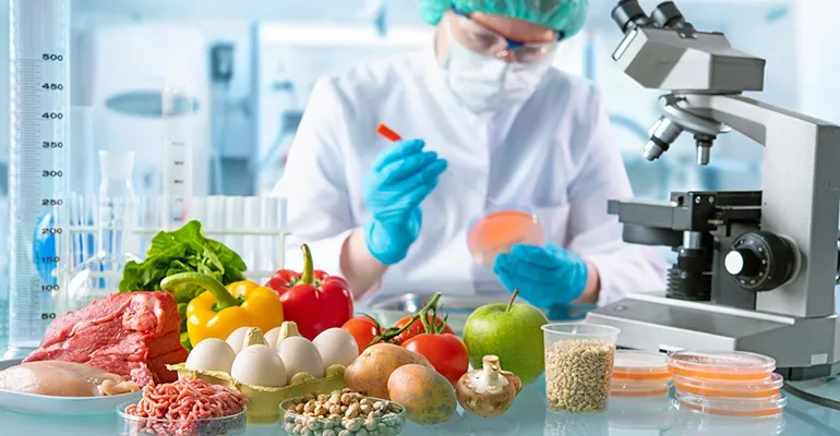 Scientist in a lab uses digital PCR to test various foods for safety and contamination risks.